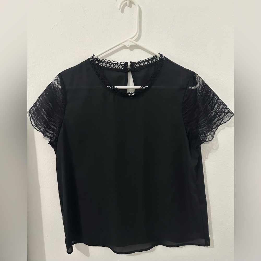 New- Black short sleeve top - No size shown but runs as a Medium